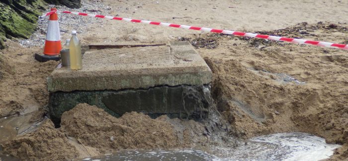 Sewage leaking from the manhole at South Sands Beach